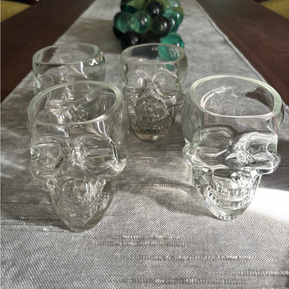 4 heavy glass skulls